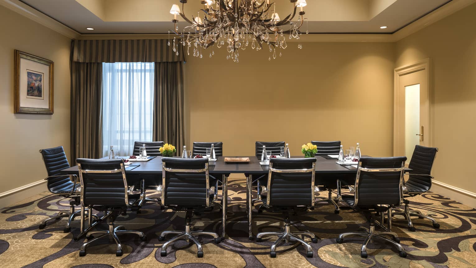Long boardroom meeting table with leather swivel chairs 