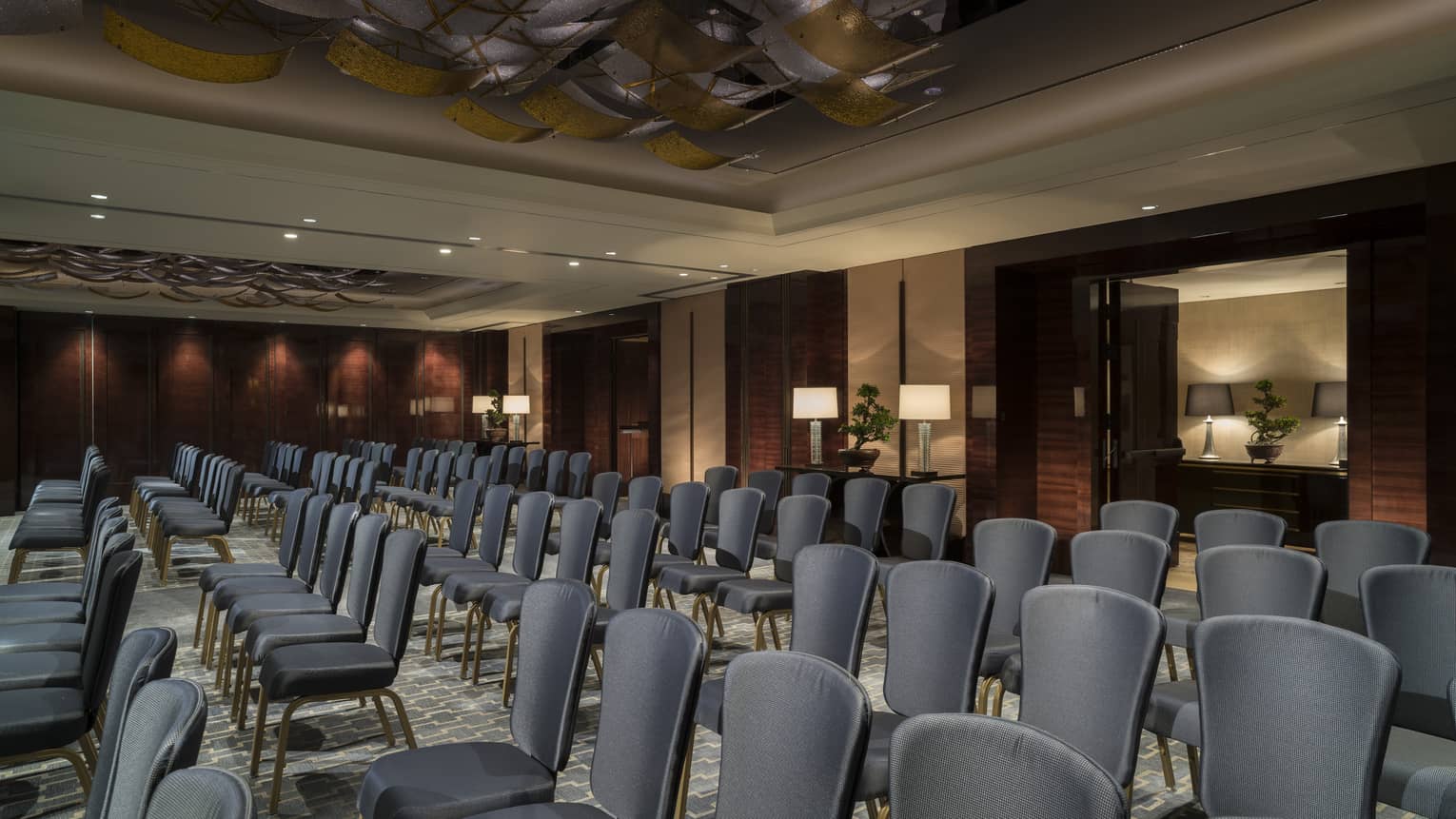 Rows of meeting chairs in ballroom conference and event space 