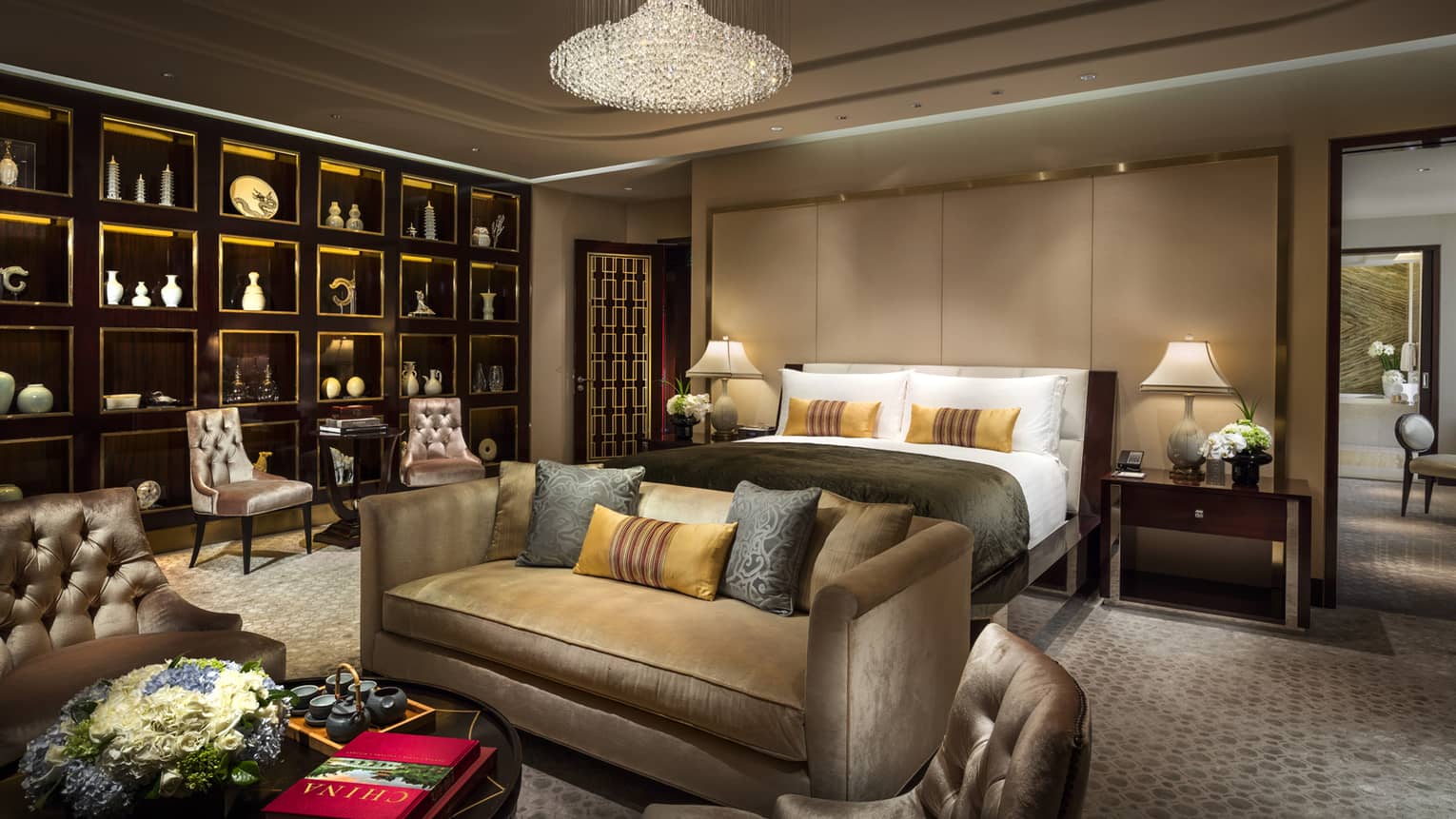 The Imperial Suite’s opulent bedroom, including a full living area and a wall of art works